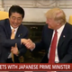 Illustration for article titled President Trump Bestows Deeply Uncomfortable Handshake on Japanese Prime Minister